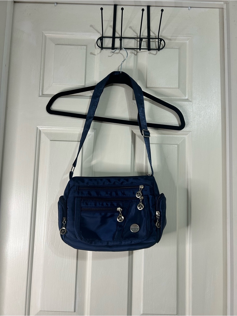 Compact Navy Crossbody Bag with Multiple Zip Pockets